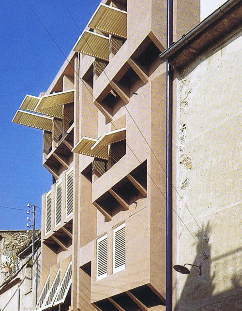 Picture of the facade where it is possible to see how the different positions of the blinds and the different solutions of the facade achieve a really interesting composition which the user's need can change during the day.